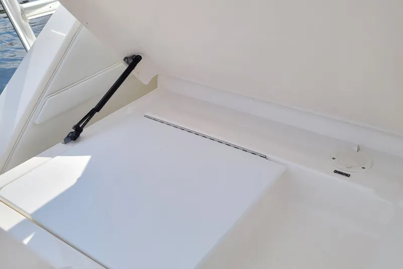 Slide: The Image of 1997 Wellcraft 330 Coastal boat interior storage compartment with hydraulic lift. - 16