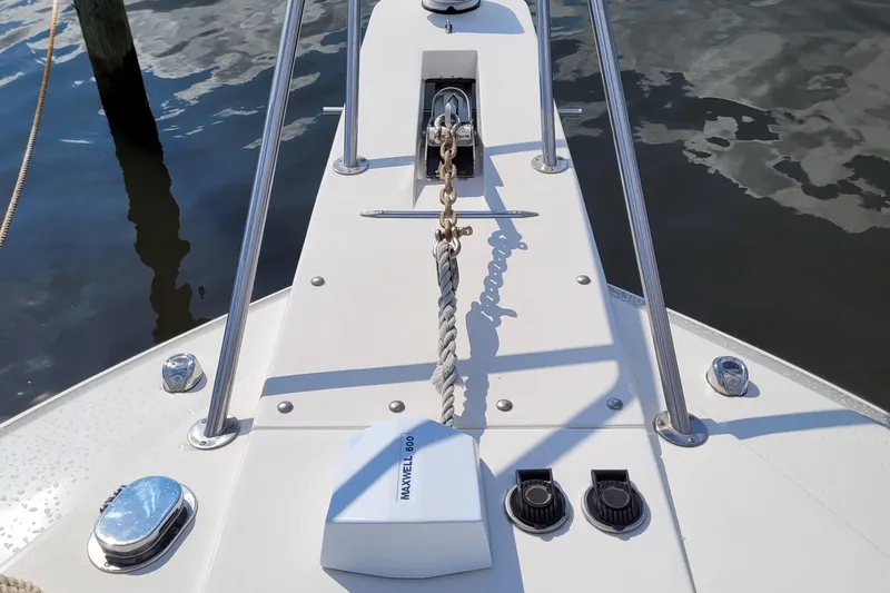 Slide: The Image of Bow of 1997 Wellcraft 330 Coastal boat with anchor chain and winch. - 9