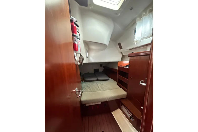 Slide: The Image of Cozy cabin interior of 2004 Beneteau Oceanis 423 sailboat with wooden furnishings. - 26