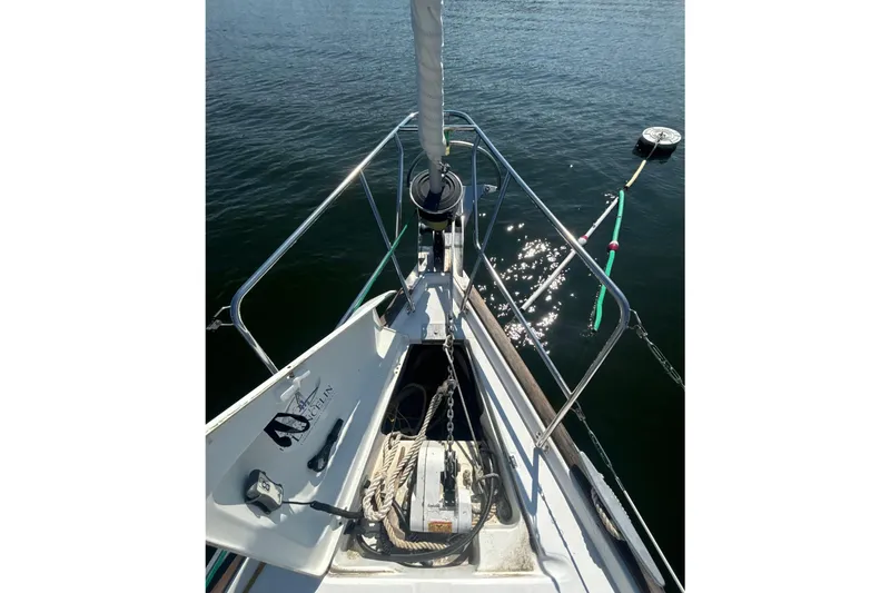 Slide: The Image of Bow of 2004 Beneteau Oceanis 423 sailboat with anchor and calm water. - 7