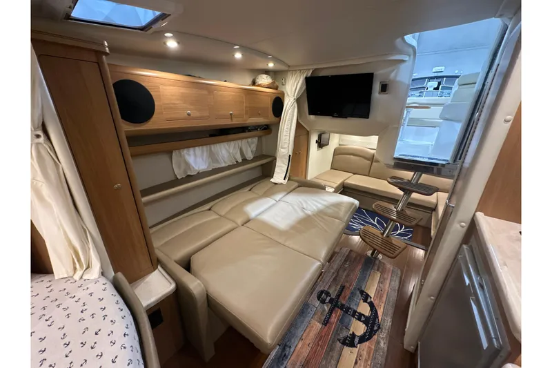 Slide: The Image of Luxurious interior of 2015 Rinker 340 Express Cruiser with leather seating and modern amenities. - 24