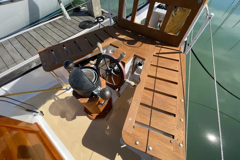 Slide: The Image of Wooden deck of 2008 Pinky Custom boat with steering wheel and compass. - 15