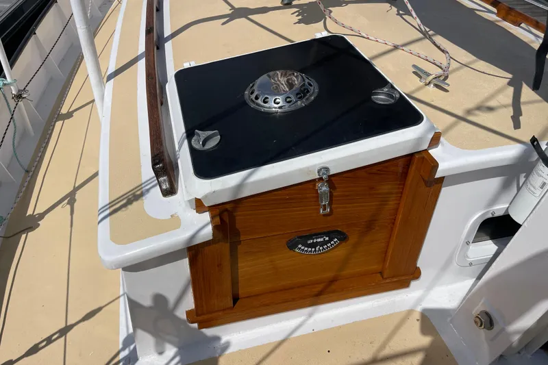 Slide: The Image of Wooden deck feature on 2008 Pinky Custom boat with metal fixture and latch. - 16