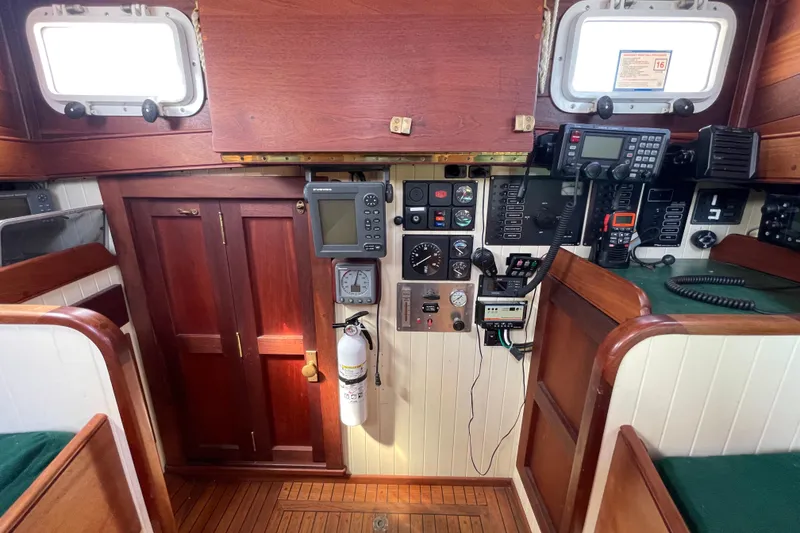 Slide: The Image of Interior of 2008 Pinky Custom boat with navigation equipment and wooden cabinetry. - 25