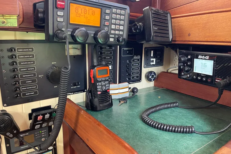 Slide: The Image of Control panel with communication devices and switches on a 2008 Pinky Custom boat. - 27