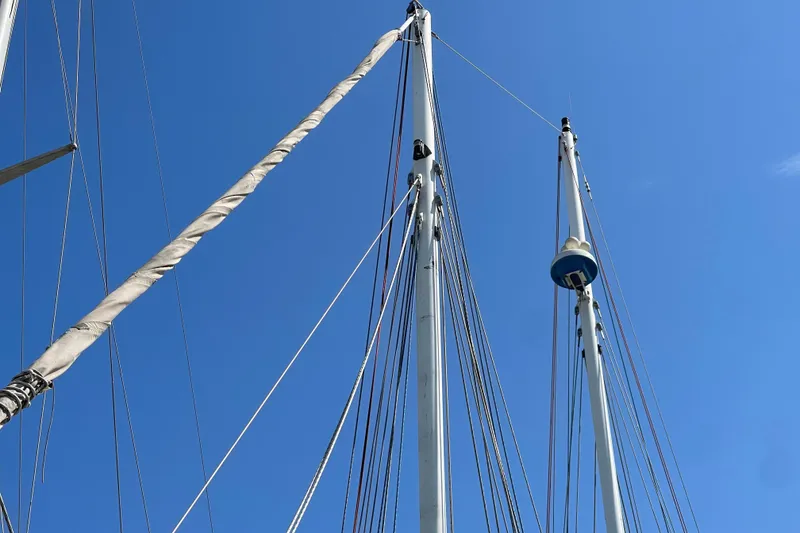 Slide: The Image of Sailboat masts and rigging against a clear blue sky, Pinky Custom 2008 model. - 32