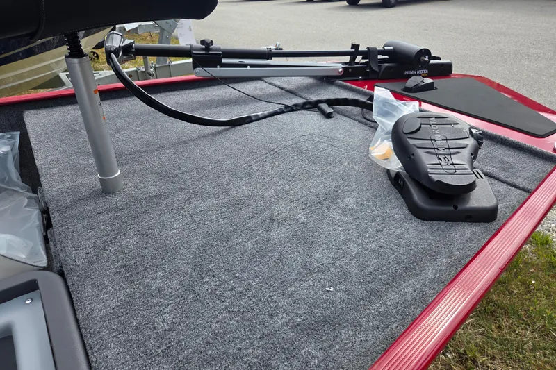 Slide: The Image of 2026 Tracker BT CLASSIC XL boat deck with Minn Kota trolling motor and foot pedal. - 10