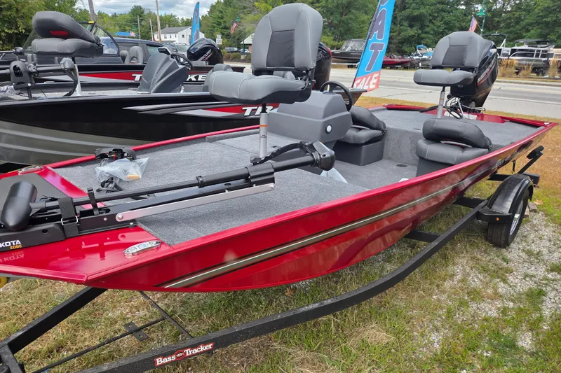 Slide: The Image of 2026 Tracker BT CLASSIC XL boat, red exterior, gray interior, displayed outdoors. - 3