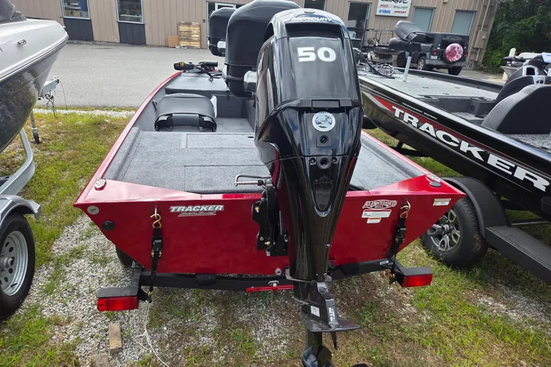 Slide: The Image of 2026 Tracker BT CLASSIC XL boat with Mercury 50 engine, parked outdoors. - 4