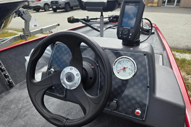 Slide: The Image of Steering wheel and dashboard of 2026 Tracker BT CLASSIC XL boat with Garmin device. - 7