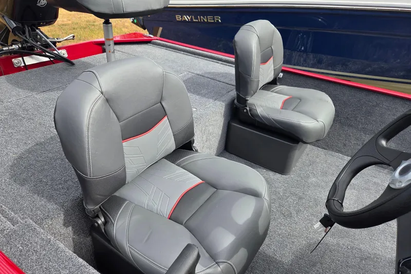 Slide: The Image of 2026 Tracker BT CLASSIC XL boat interior with gray seats and steering wheel. - 8