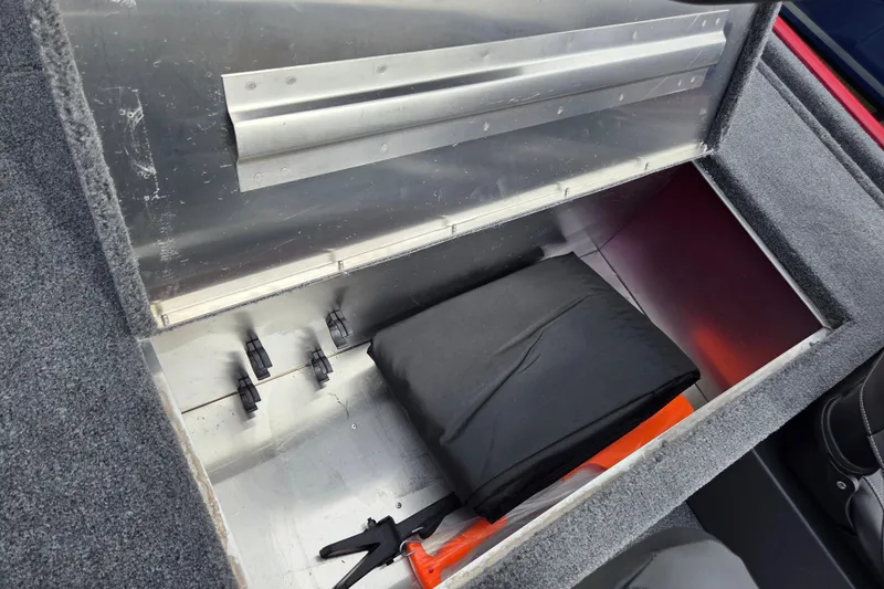 Slide: The Image of Open storage compartment in 2026 Tracker BT CLASSIC XL boat, featuring organized interior space. - 9