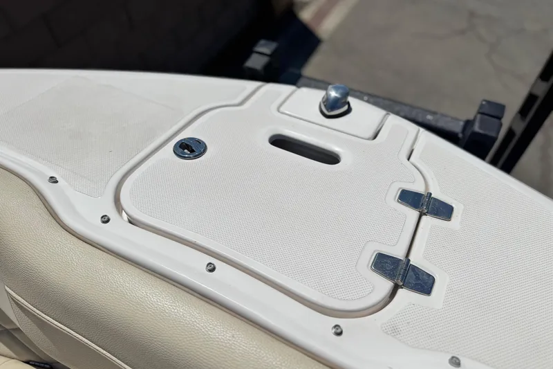 Slide: The Image of 2018 Regal 23 OBX boat hatch with lock and hinges, beige upholstery. - 13