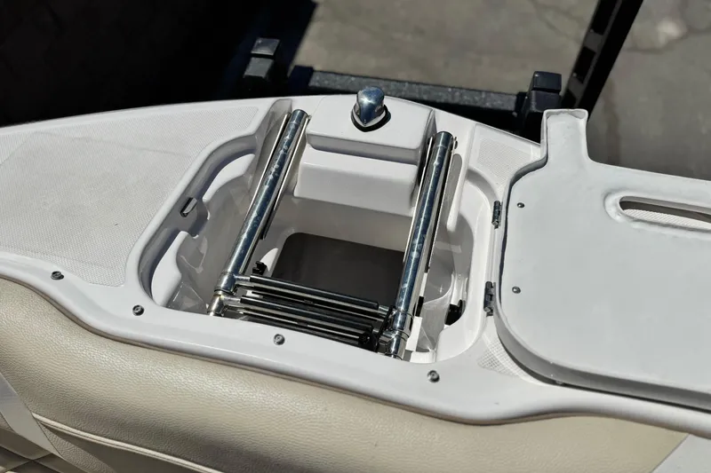 Slide: The Image of 2018 Regal 23 OBX boat ladder compartment with stainless steel hardware. - 14