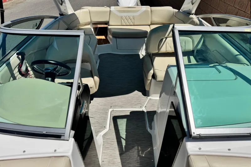 Slide: The Image of 2018 Regal 23 OBX boat interior with beige seating and modern design. - 17