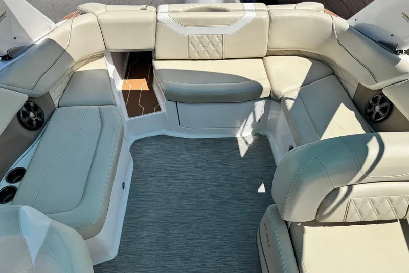 Slide: The Image of Luxurious seating area on a 2018 Regal 23 OBX boat, featuring beige upholstery. - 18