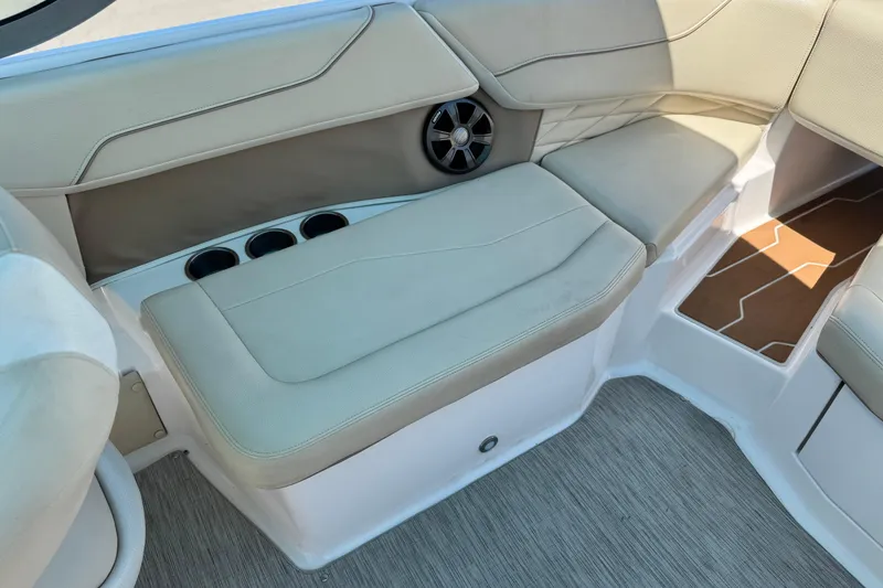 Slide: The Image of 2018 Regal 23 OBX boat interior with beige seating and cup holders. - 19