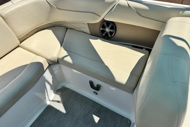 Slide: The Image of 2018 Regal 23 OBX boat interior with beige seating and speaker. - 21