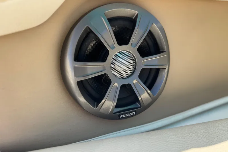 Slide: The Image of Speaker on 2018 Regal 23 OBX boat interior, featuring Fusion audio system. - 24