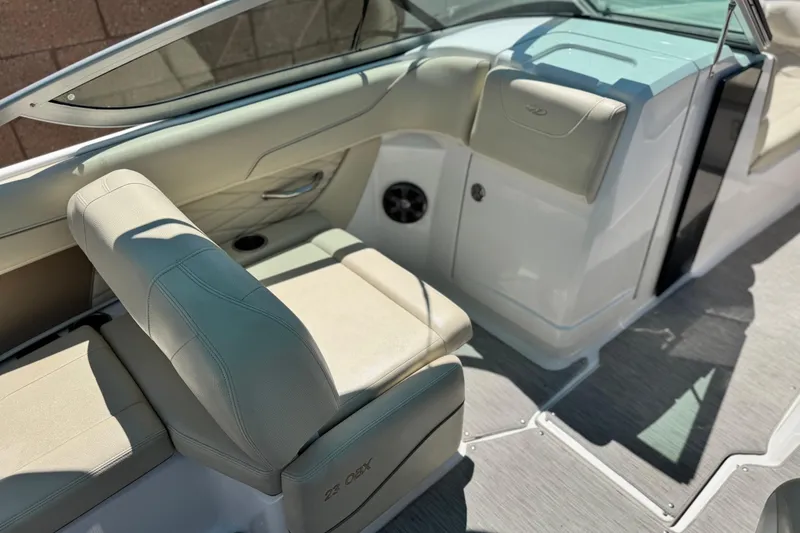 Slide: The Image of 2018 Regal 23 OBX boat interior with beige seating and modern design. - 25