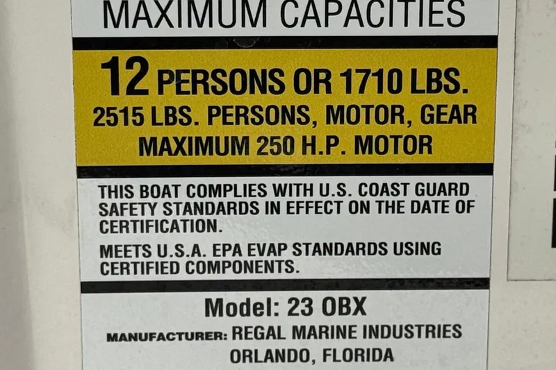 Slide: The Image of 2018 Regal 23 OBX capacity label, 12 persons or 1710 lbs, 250 H.P. motor. - 33