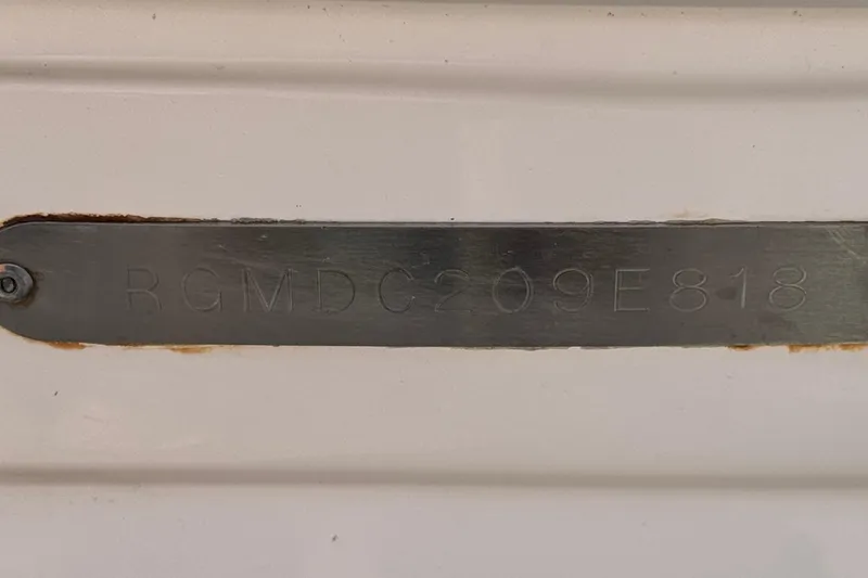 Slide: The Image of 2018 Regal 23 OBX boat identification plate with serial number RGMDC209E818. - 34