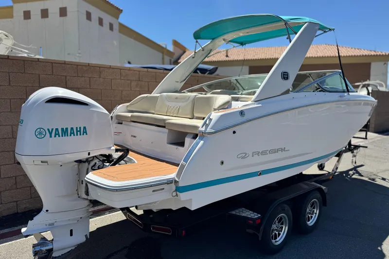 Slide: The Image of 2018 Regal 23 OBX boat with Yamaha outboard motor on a trailer. - 5