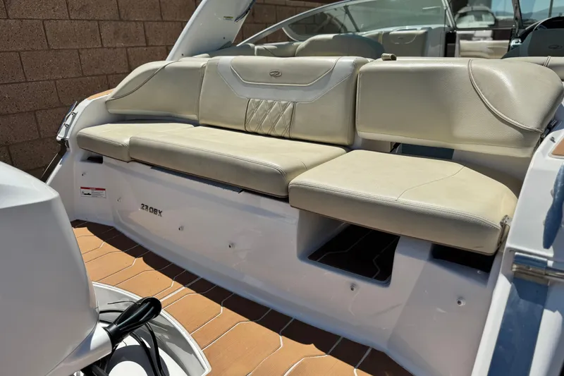 Slide: The Image of 2018 Regal 23 OBX boat with beige leather seating and sleek design. - 7
