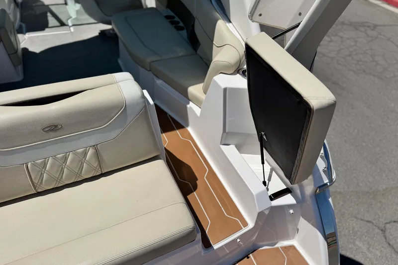 Slide: The Image of 2018 Regal 23 OBX boat interior with beige seating and wood-style flooring. - 8