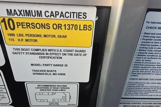 Slide: The Image of 2026 Sun Tracker PB 20 DLX capacity label, 10 persons or 1370 lbs, U.S. Coast Guard compliant. - 13