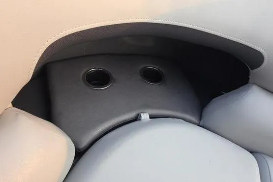 Slide: The Image of 2026 Sun Tracker PB 20 DLX boat seating with integrated cup holders. - 17