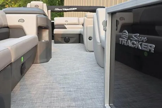 Slide: The Image of 2026 Sun Tracker PB 20 DLX pontoon boat interior with plush seating and sleek design. - 5