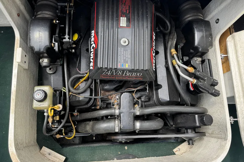 Slide: The Image of Engine compartment of a 1995 Celebrity 220 BR boat with MerCruiser 7.4L V8 Bravo. - 12