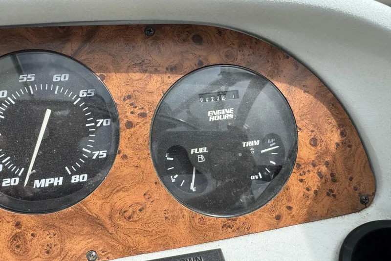 Slide: The Image of Dashboard of a 1995 Celebrity 220 BR boat showing speedometer and engine hours. - 7