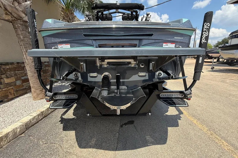 Slide: The Image of 2022 Centurion Ri245 boat rear view with advanced wakeboard features. - 7