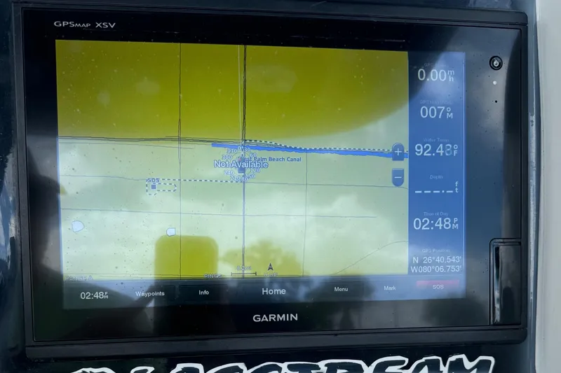 Slide: The Image of Garmin GPS display on 2015 Glasstream 280 ZS, showing navigation data and water temperature. - 10