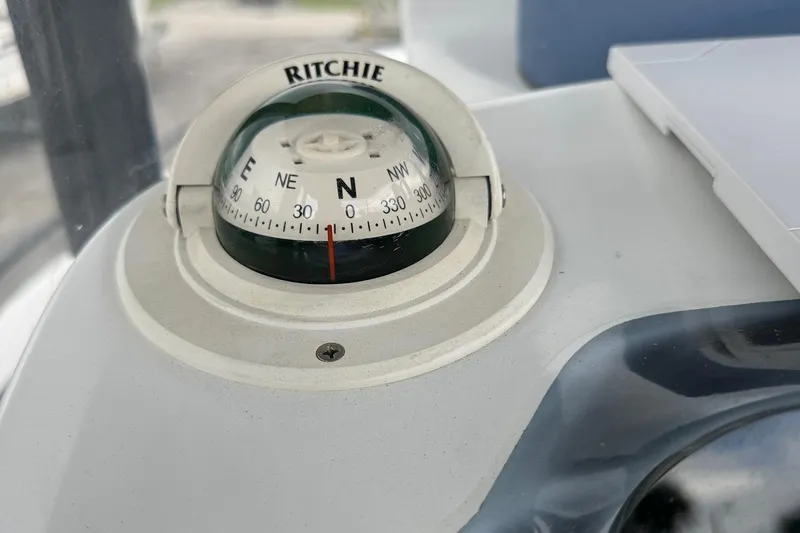 Slide: The Image of Compass on 2015 Glasstream 280 ZS boat dashboard, showing north direction. - 12