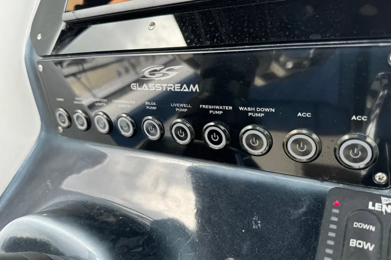 Slide: The Image of Control panel of a 2015 Glasstream 280 ZS boat with various pump switches. - 13