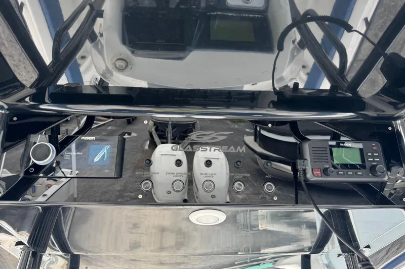 Slide: The Image of Control panel of 2015 Glasstream 280 ZS boat with Fusion and Garmin devices. - 14