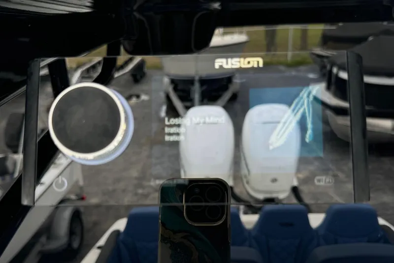 Slide: The Image of 2015 Glasstream 280 ZS boat dashboard with Fusion audio display and controls. - 15