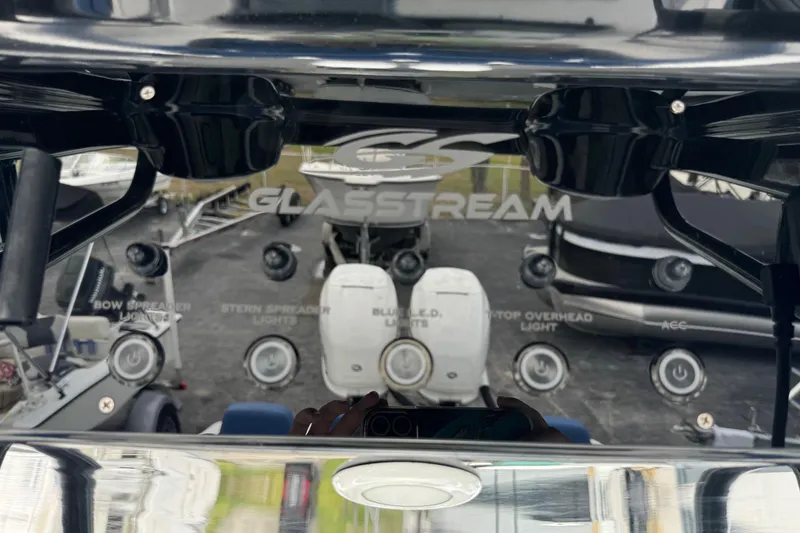 Slide: The Image of 2015 Glasstream 280 ZS dashboard with control buttons and logo. - 17