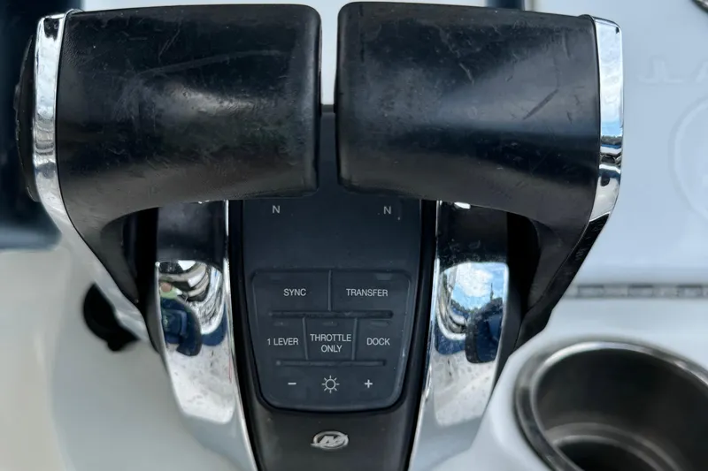 Slide: The Image of Close-up of 2015 Glasstream 280 ZS boat throttle controls with buttons and levers. - 18