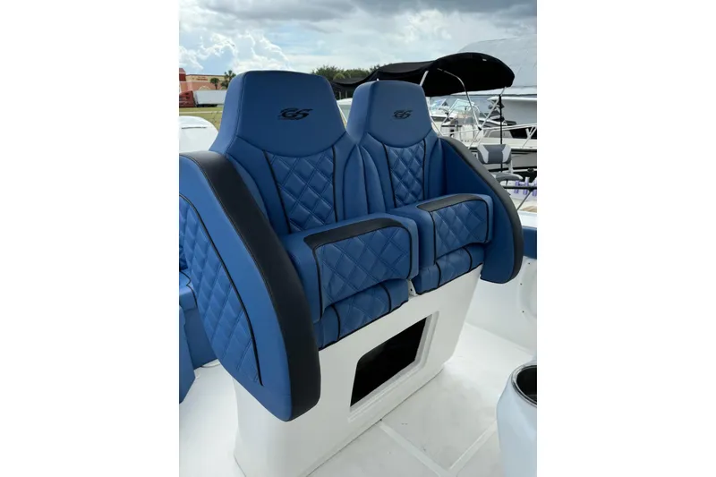 Slide: The Image of Blue leather seats on a 2015 Glasstream 280 ZS boat, featuring quilted design. - 20