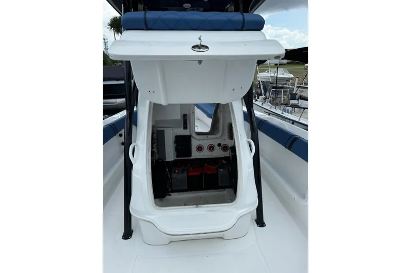 Slide: The Image of 2015 Glasstream 280 ZS boat interior with open storage compartment and visible equipment. - 31