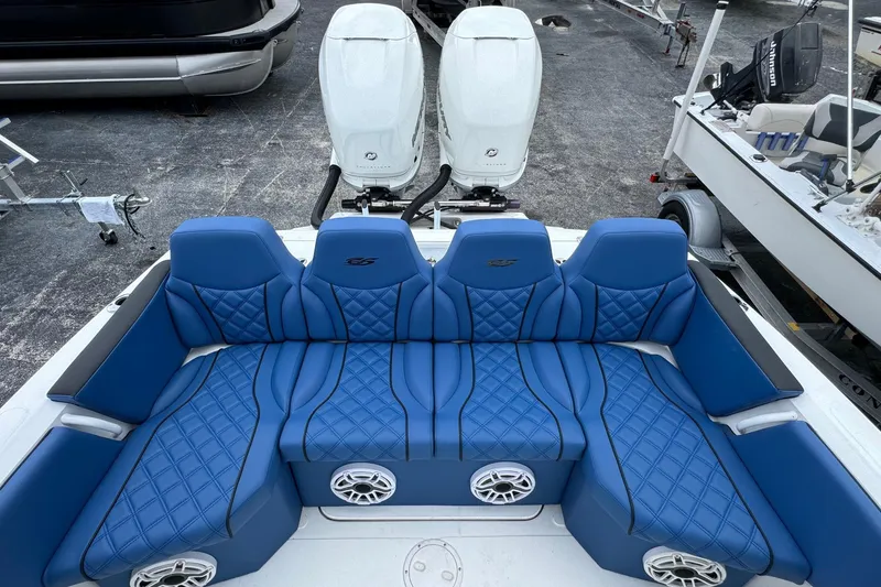 Slide: The Image of 2015 Glasstream 280 ZS boat with blue quilted seating and dual outboard motors. - 40