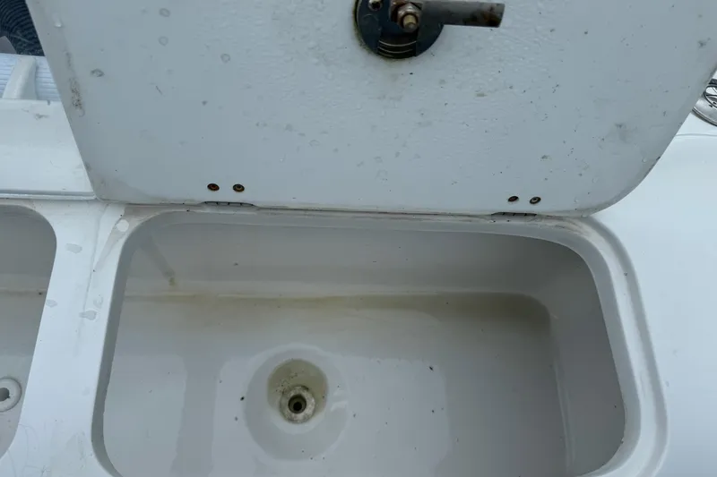 Slide: The Image of Open storage compartment on a 2015 Glasstream 280 ZS boat. - 44