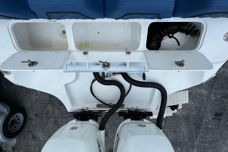 Slide: The Image of 2015 Glasstream 280 ZS boat stern with storage compartments and dual engines. - 45