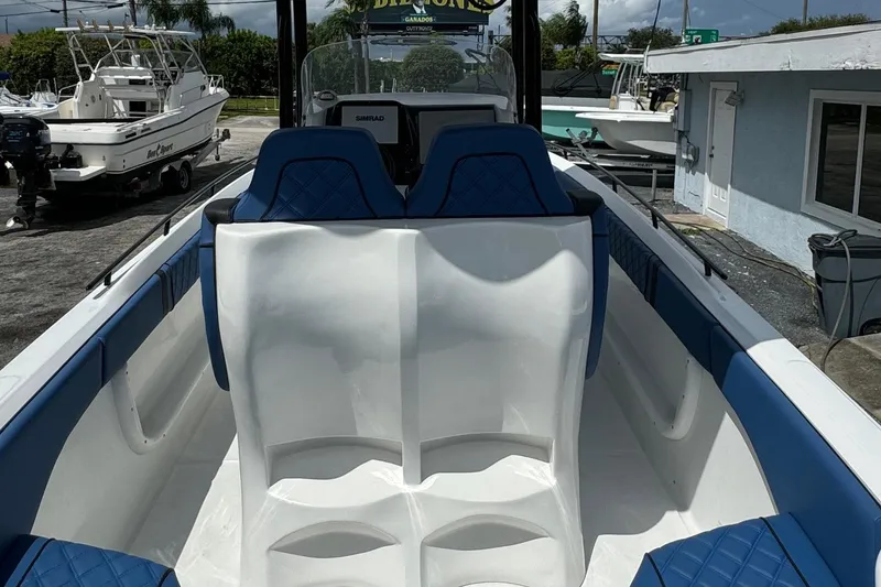 Slide: The Image of 2015 Glasstream 280 ZS boat interior with blue seating and modern dashboard. - 5
