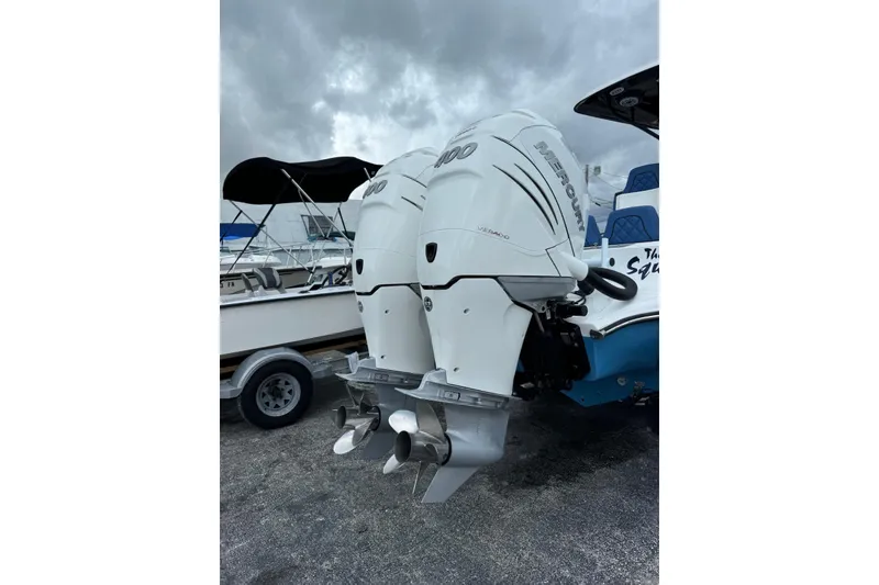 Slide: The Image of 2015 Glasstream 280 ZS with twin Mercury outboard engines, parked on a cloudy day. - 51