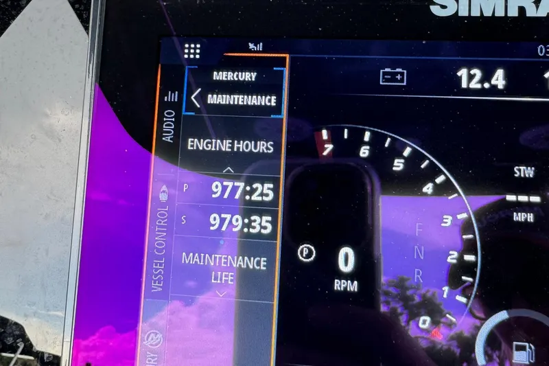 Slide: The Image of Simrad display showing engine hours on 2015 Glasstream 280 ZS boat. - 9